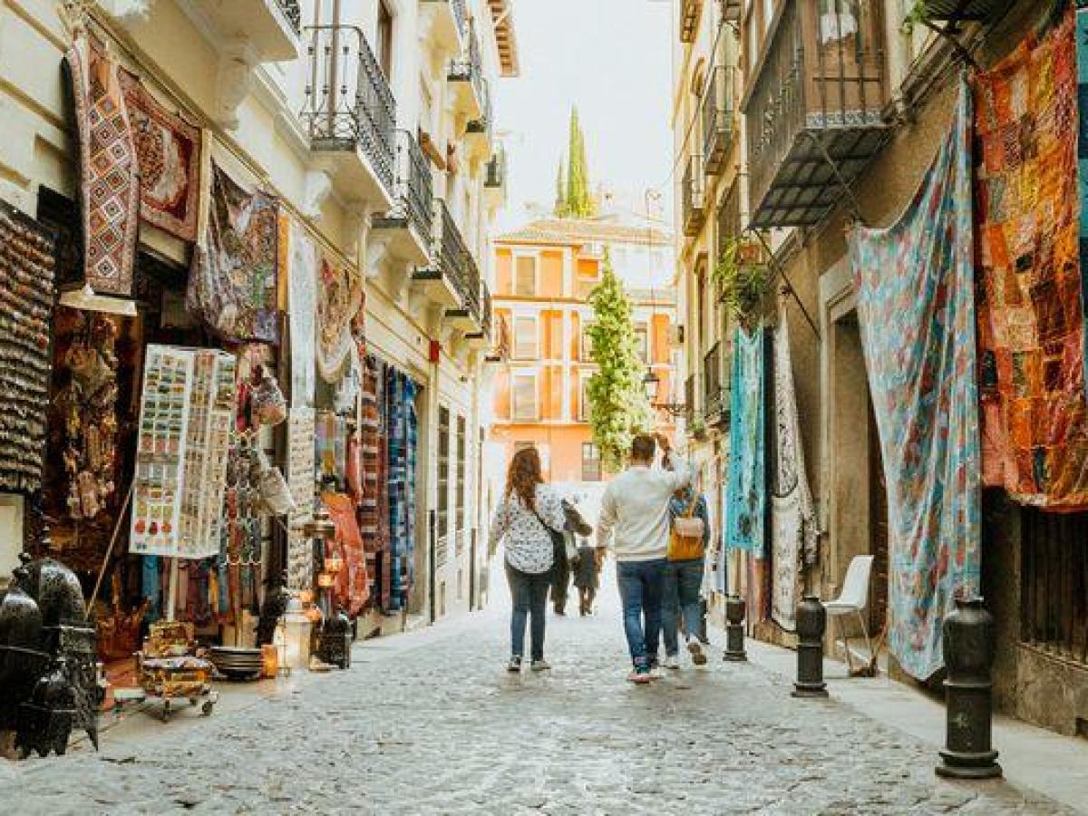 a group of people walking down a street