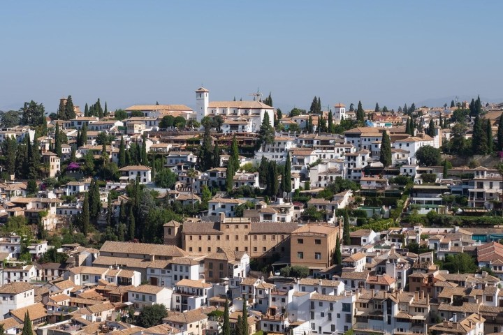 a large body of water with a city in the background